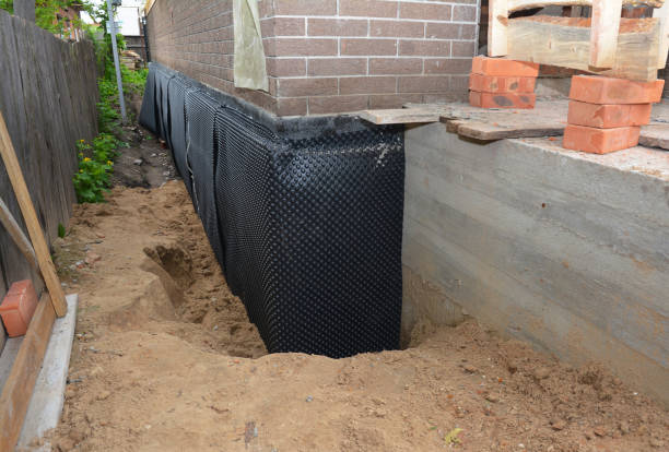 SJ Waterproofing Pros technician performing targeted Vapor Barrier Installation assessment in Bumpus Mills, TN